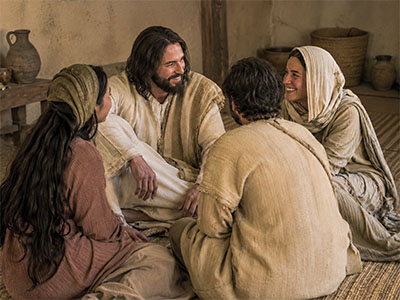 Jesus sits with Mary, Martha, and Lazarus in their home at Bethany.